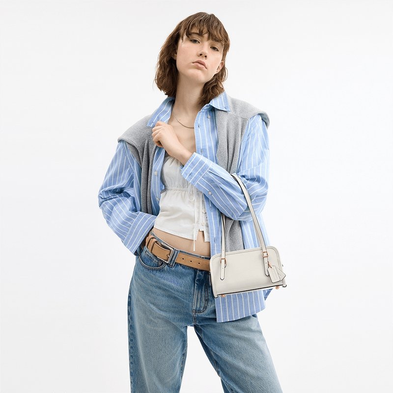 Bolsa Coach Swing Zip 20 – Elegância Compacta com Estilo Retrô