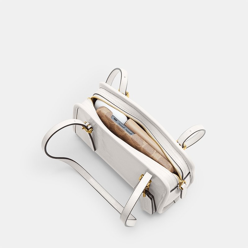 Bolsa Coach Swing Zip 20 – Elegância Compacta com Estilo Retrô